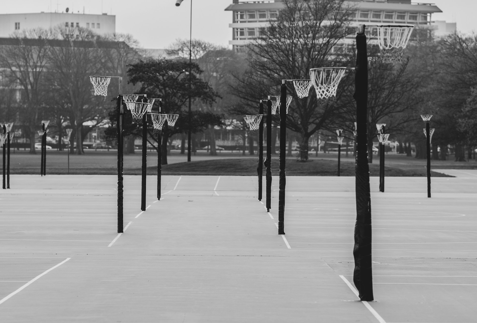 a black and white photo of a basketball court