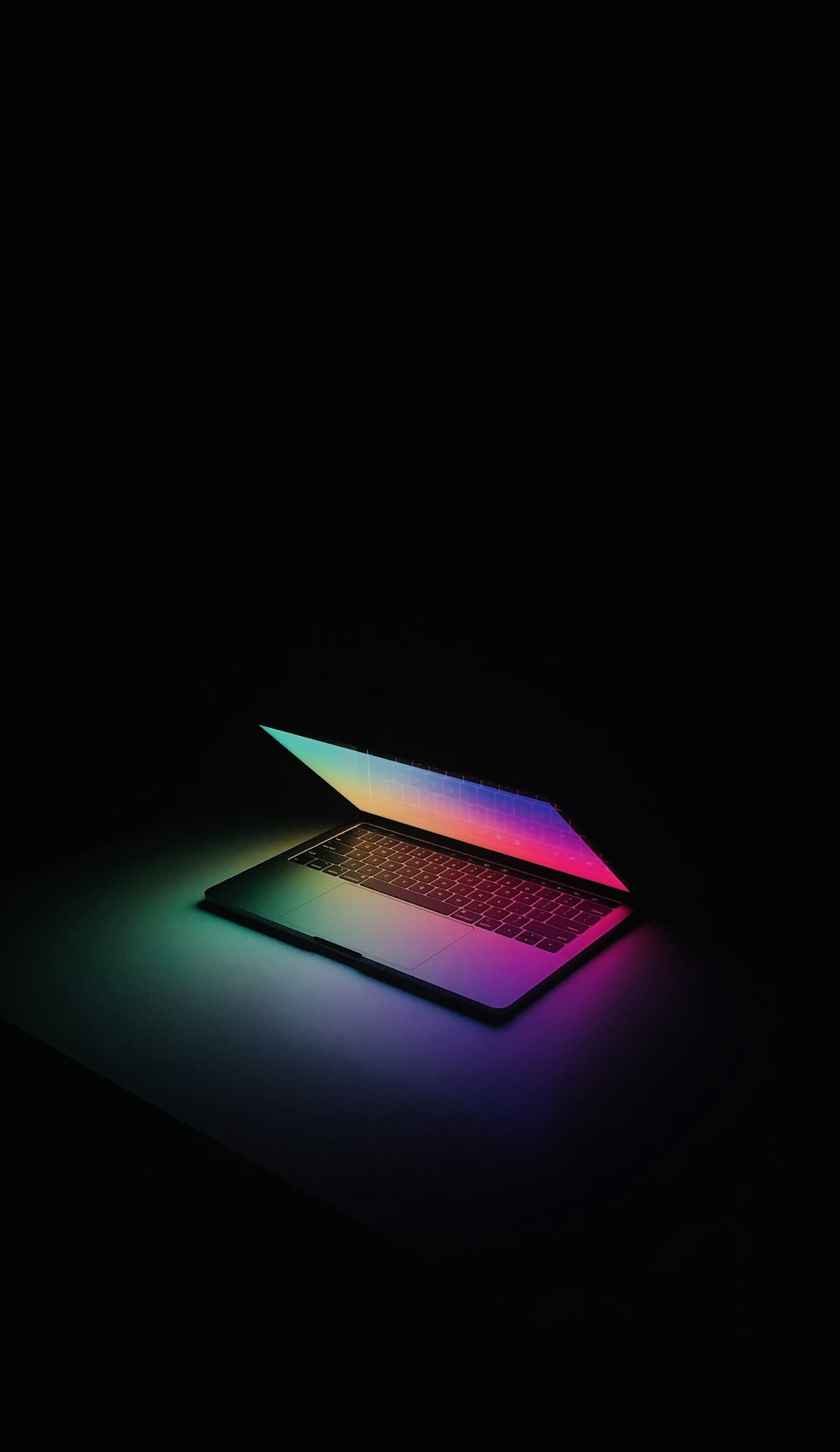 a laptop computer sitting on top of a table