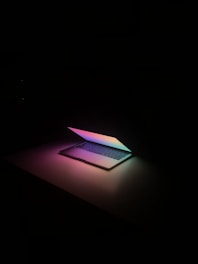 a laptop computer sitting on top of a table