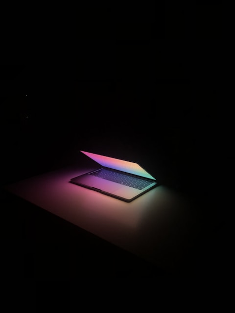 a laptop computer sitting on top of a table