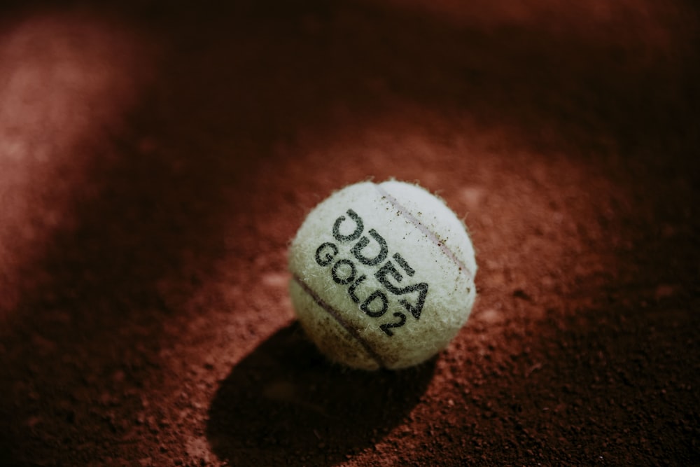 a close up of a tennis ball on a court