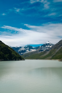 A serene landscape with mountains and a calm lake.