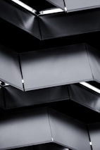 Finished architectural metal panels arranged neatly, showcasing sleek design and quality.