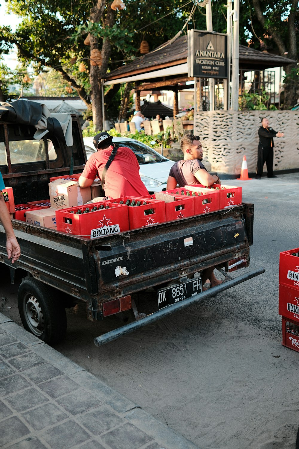 a truck with a bunch of red boxes in the back