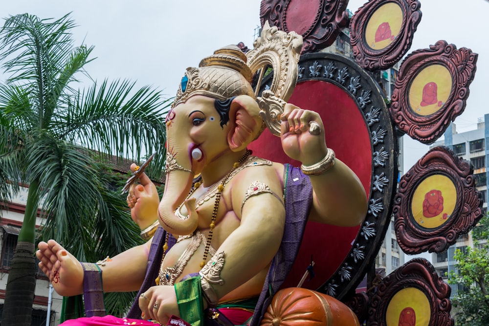 a statue of an elephant with a crown on it's head