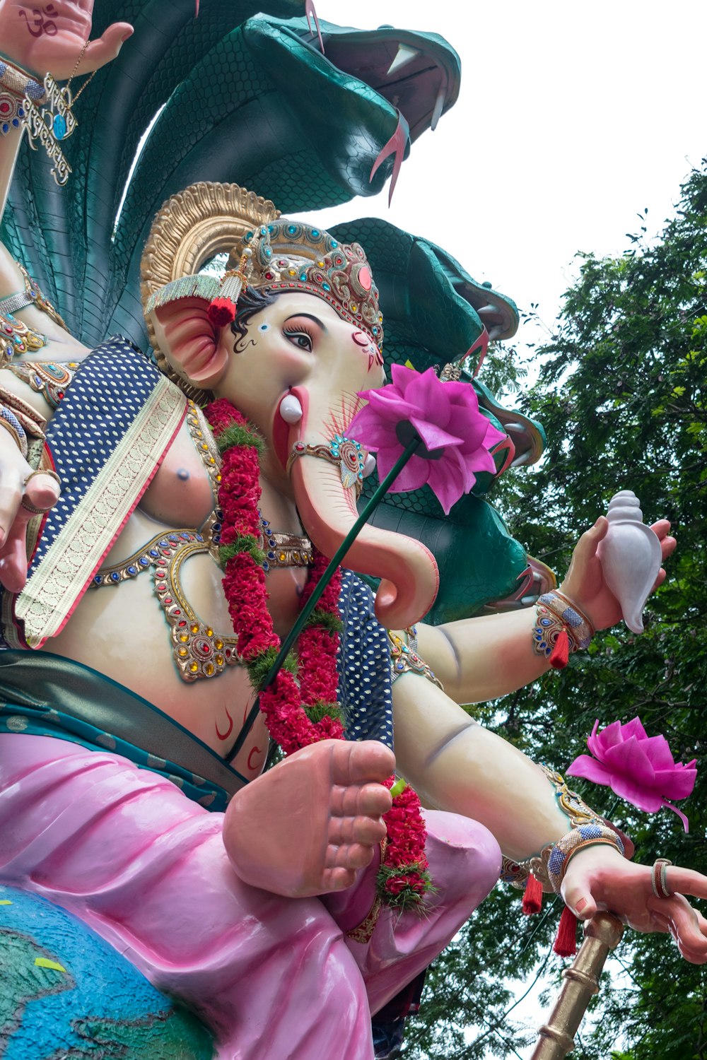 a statue of a man with a flower in his hand