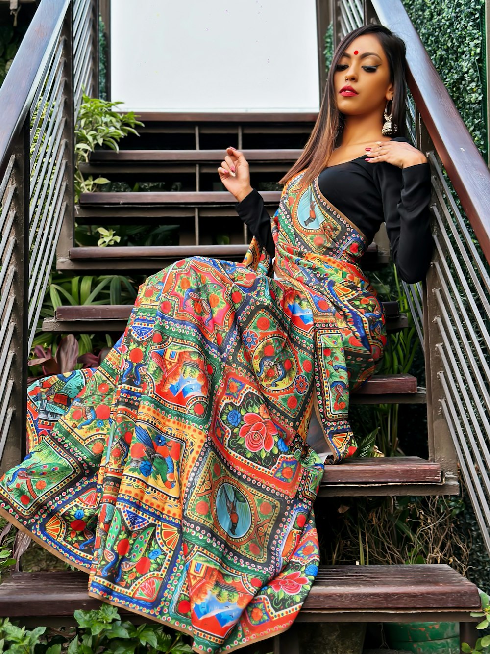 a woman is sitting on a set of stairs