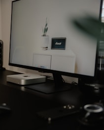 A sleek office setup showcasing advanced IT equipment and monitors.