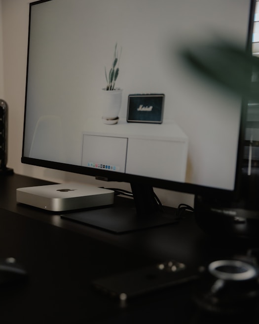 A sleek office setup featuring a desktop computer being serviced by a professional