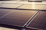 a group of solar panels sitting on top of a roof