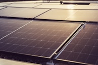 a group of solar panels sitting on top of a roof