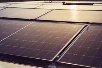 a group of solar panels sitting on top of a roof