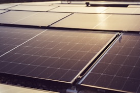 a group of solar panels sitting on top of a roof