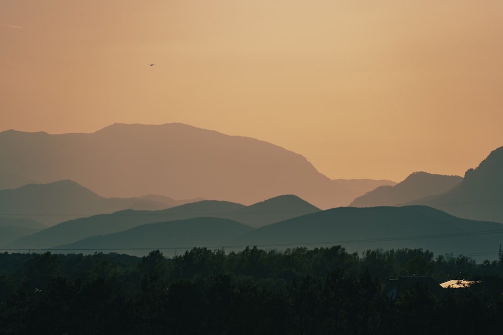 a view of a mountain range at sunset