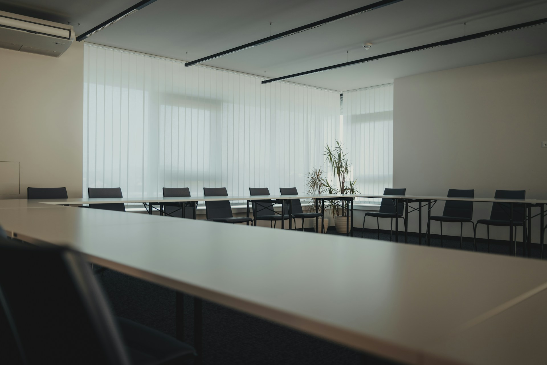 a conference room with a long table and chairs