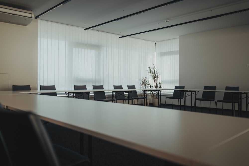 a conference room with a long table and chairs