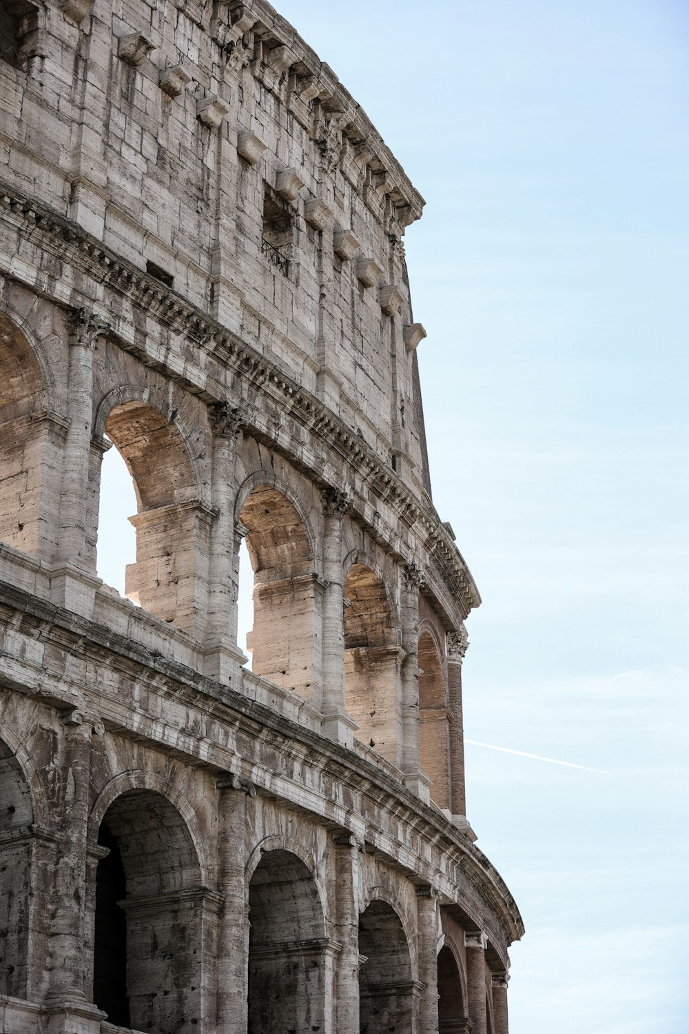 a large stone building with arches and arches