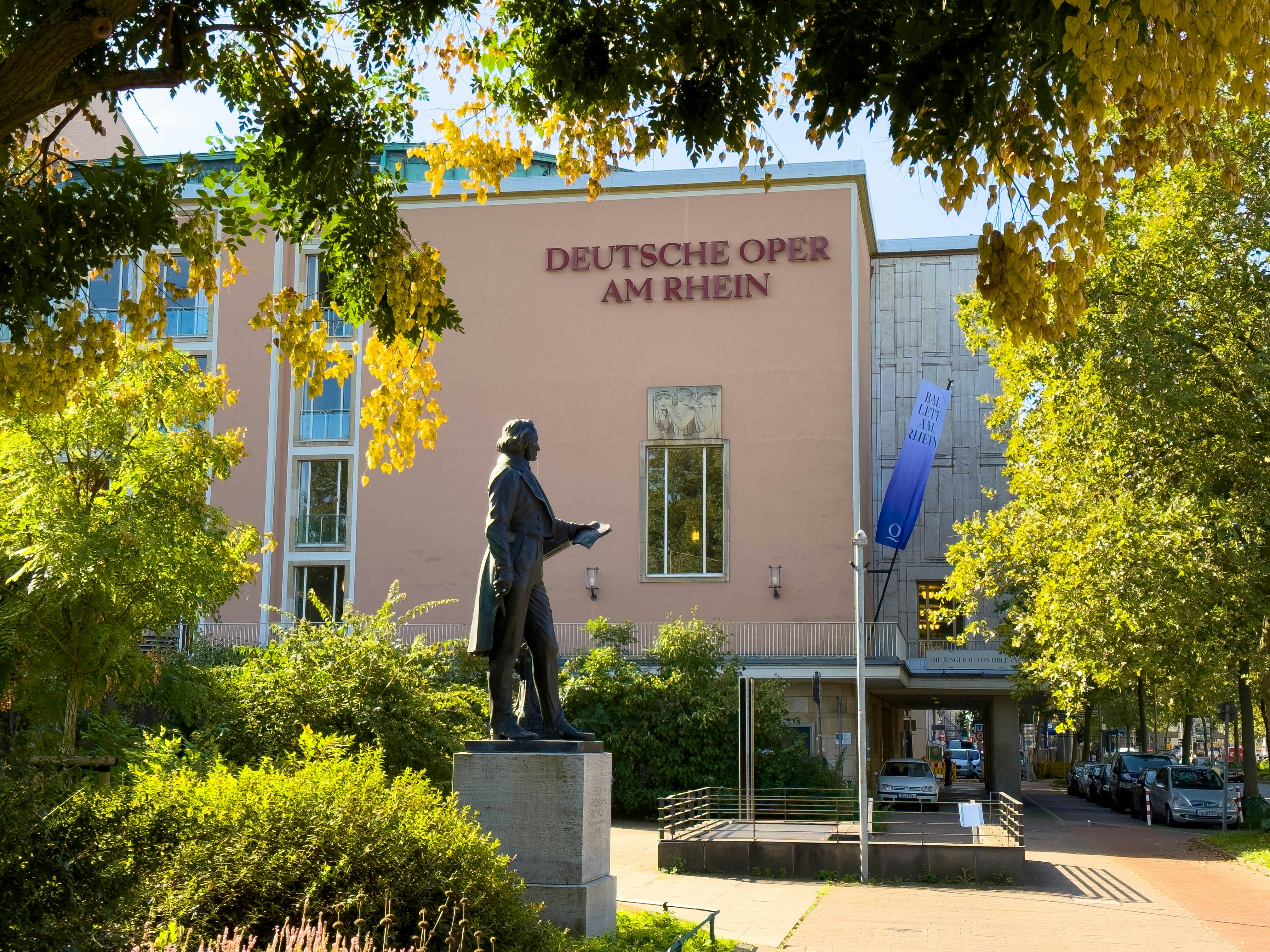 a statue of a man in front of a building
