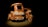 A miniature tricycle model with the word 'Philippines' displayed prominently on the front. The model is crafted to resemble a real motorized tricycle, a common mode of transportation in the Philippines, and is illuminated against a dark background, highlighting its details.