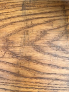 Wood grain patterns with a natural, textured surface highlighted by variations in color and line.