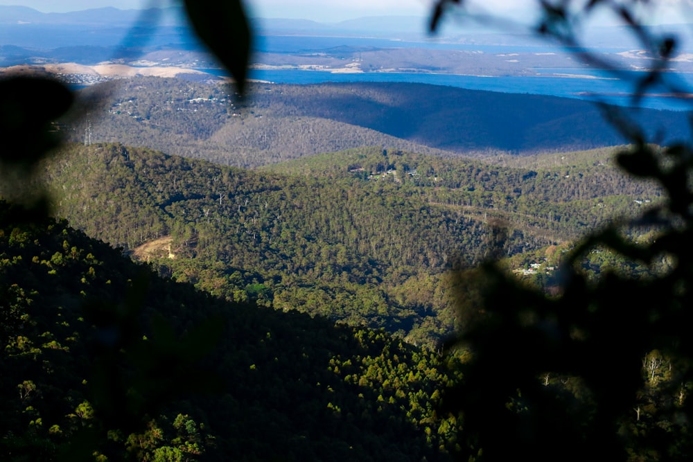 a view of a mountain range with a lake in the distance