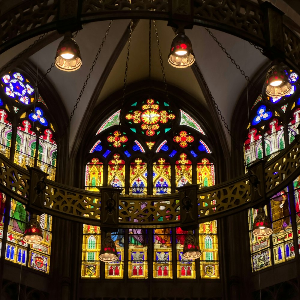 a large stained glass window inside of a building