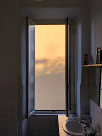 A bright bathroom gleaming with freshness after using Tibernile cleaners.