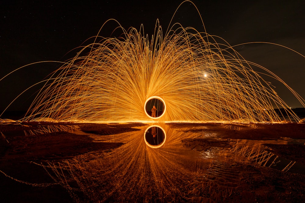 a firework spinning in the night sky