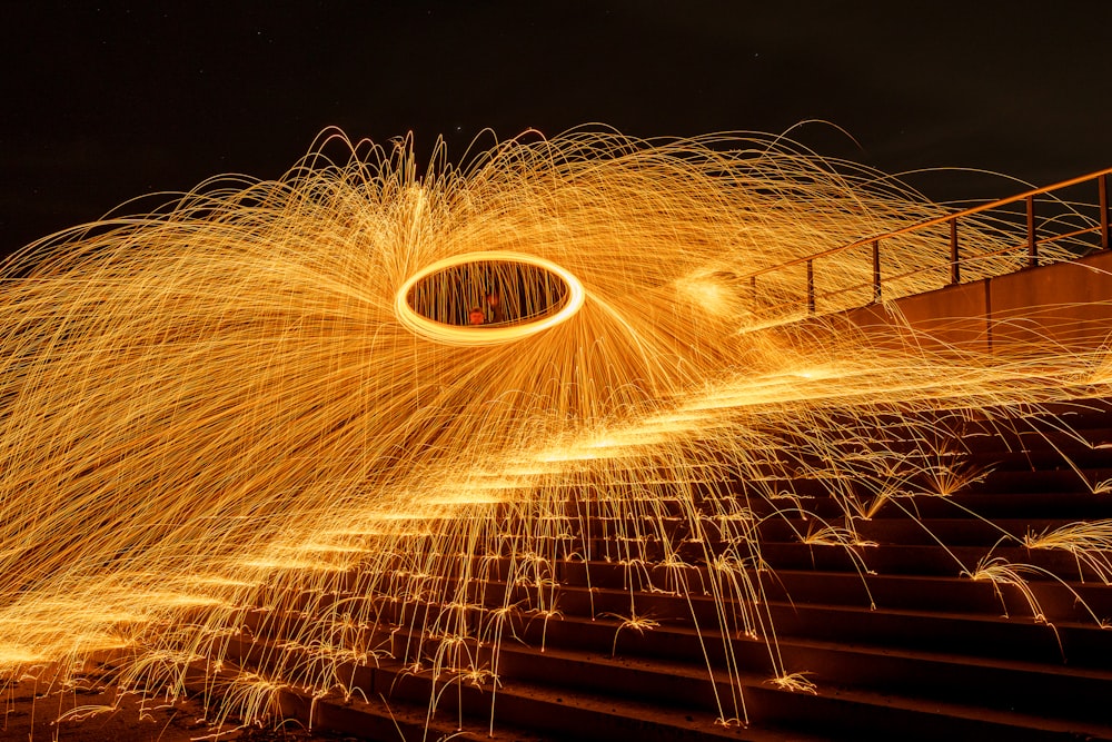 a long exposure photo of a firework display