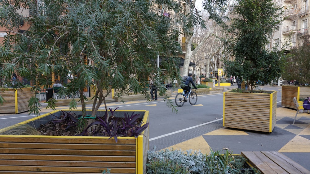 a person riding a bike on a city street