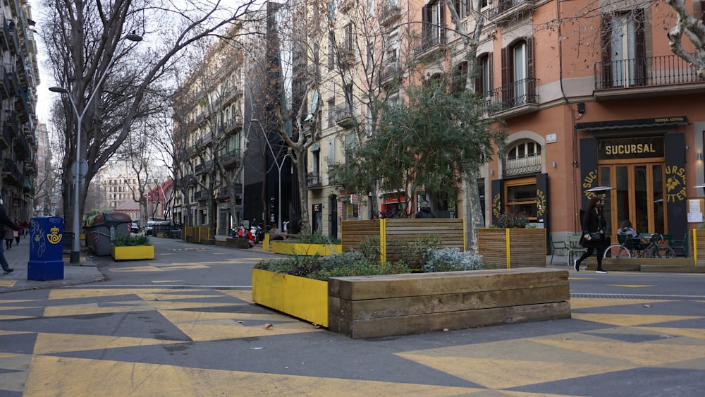 a city street with a planter on the side of the road