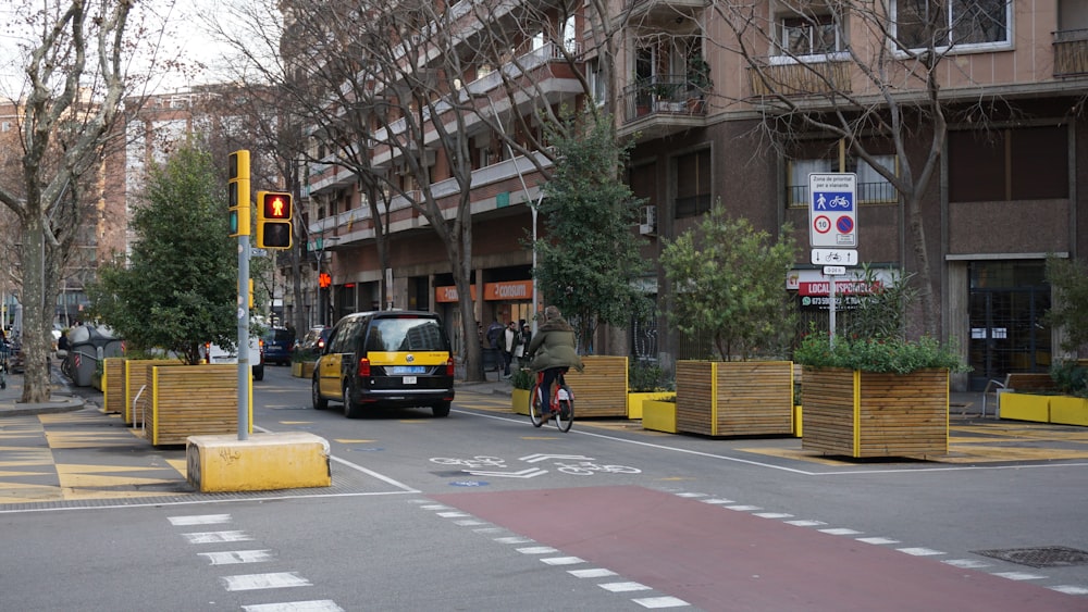 a bus driving down a street next to tall buildings