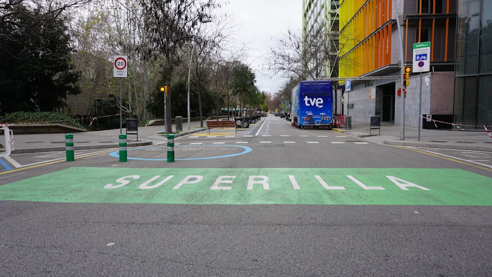 a street with a painted street sign on the side of it