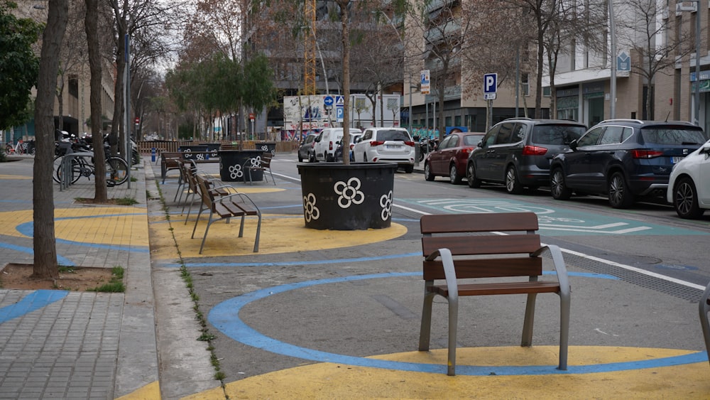 a park bench on the side of the road