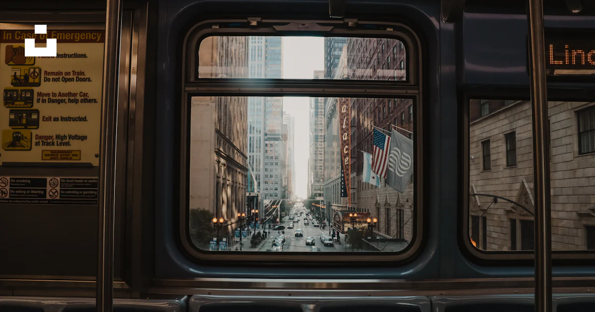 A view of a city street through a window photo – Free Wallpapers Image ...