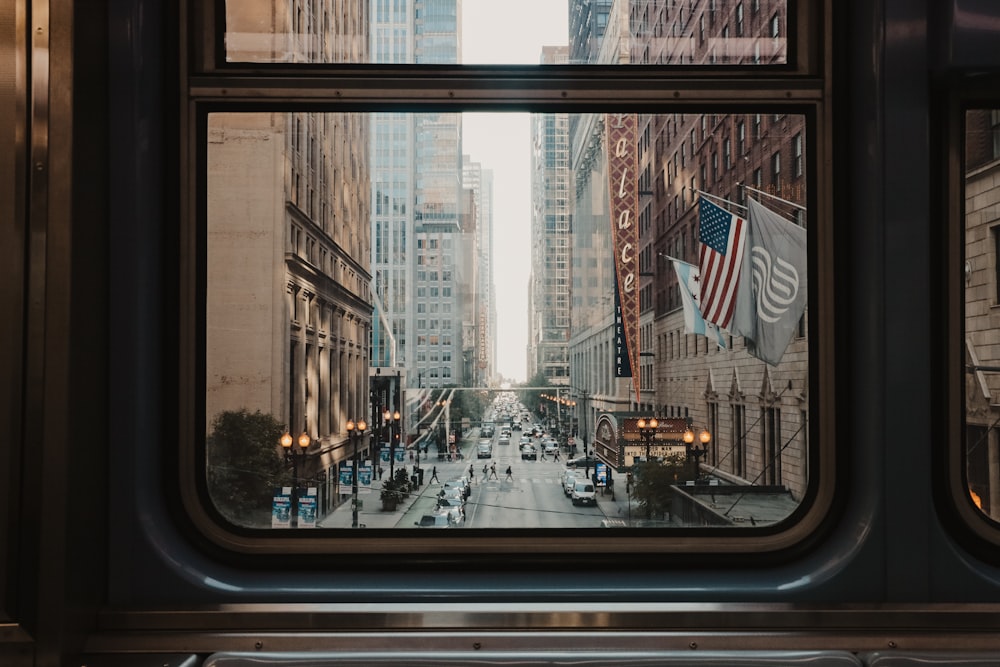 a view of a city street from a train window