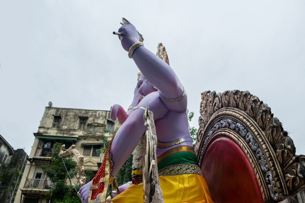 a statue of a woman on a horse in a parade