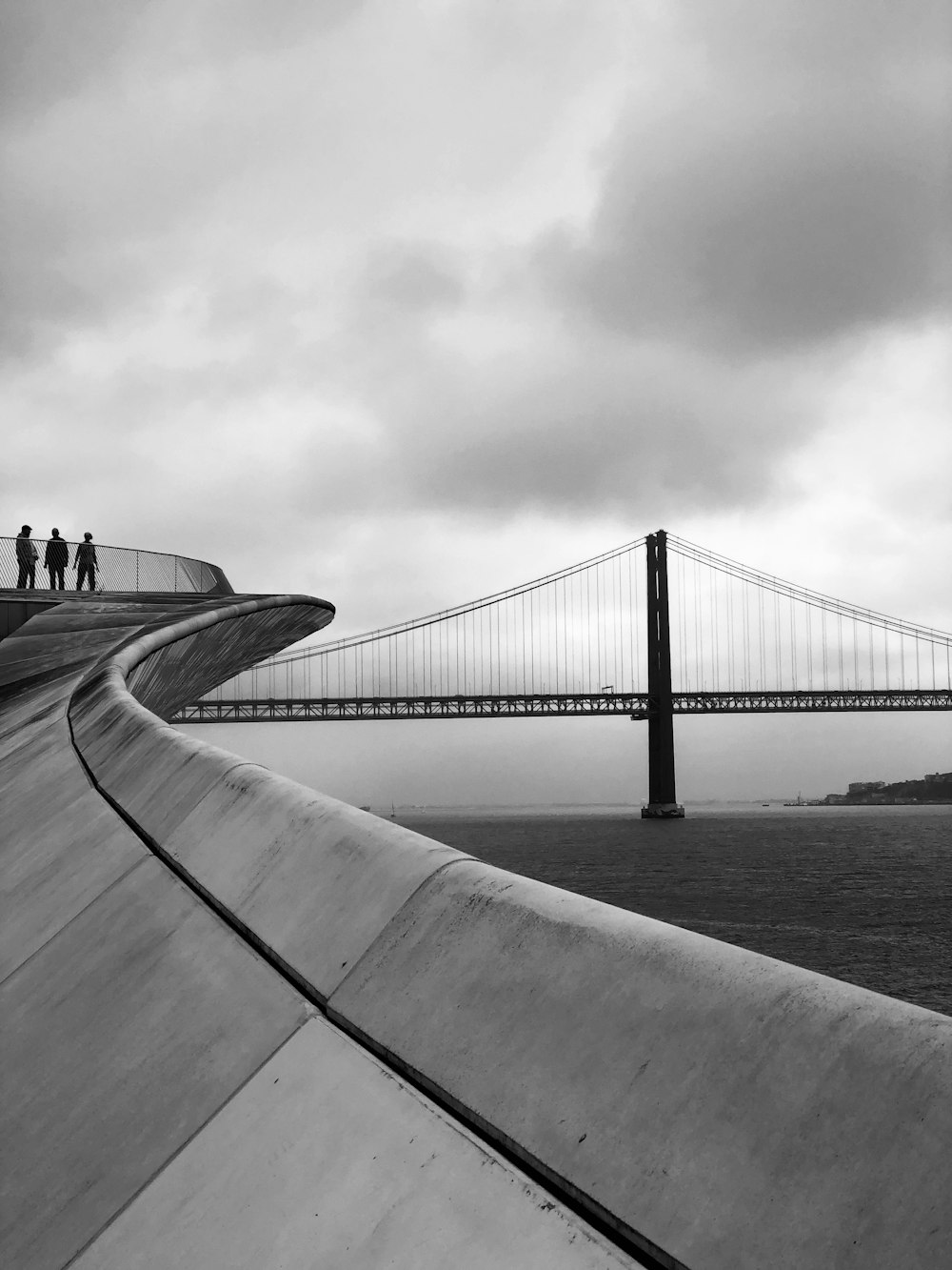 a black and white photo of a bridge