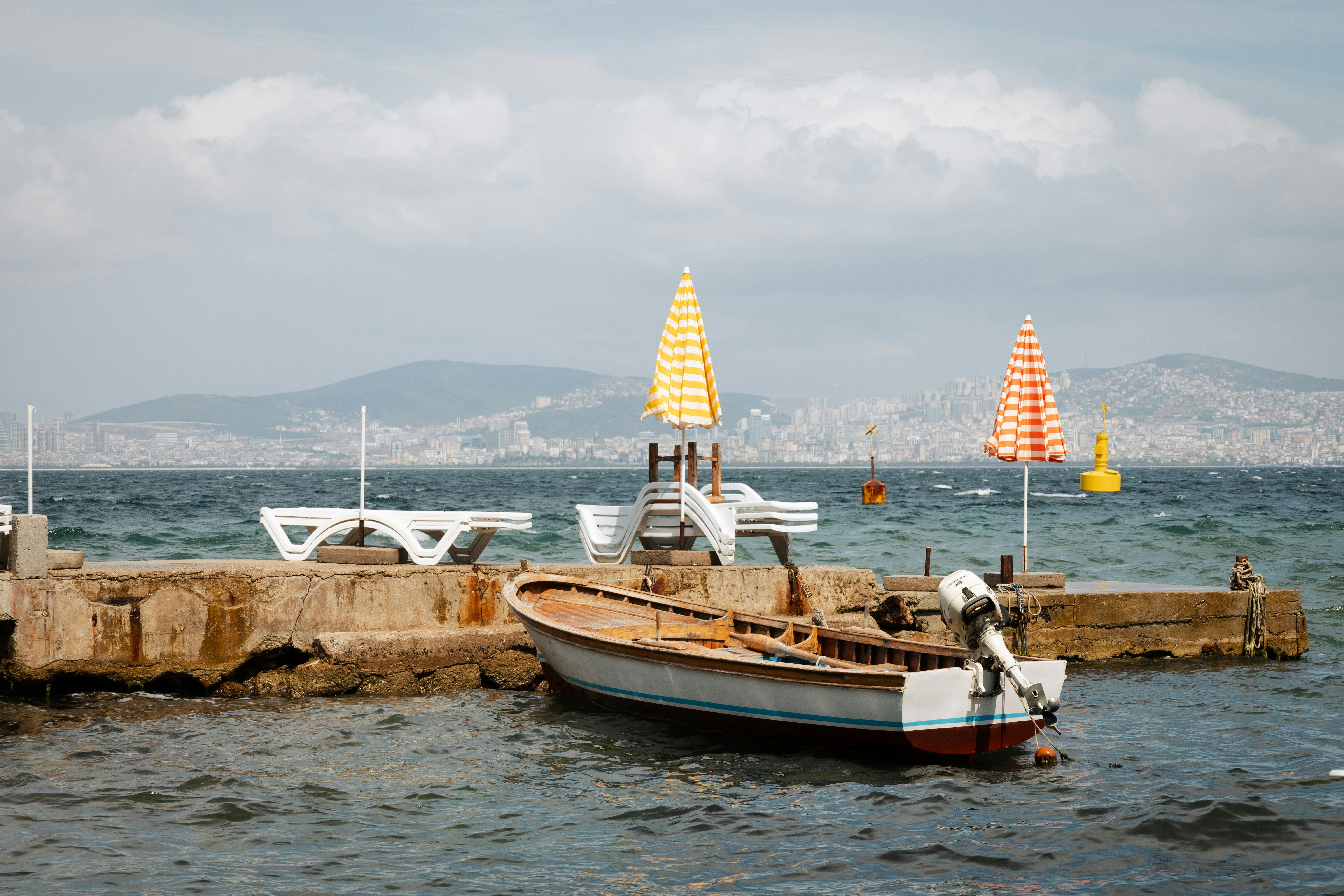 a small boat sitting on top of a body of water