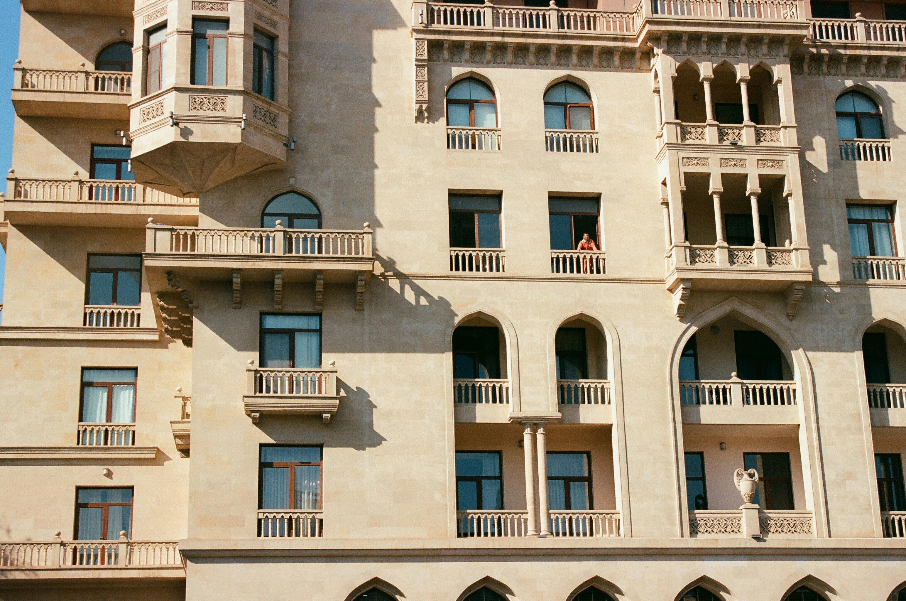 a tall building with balconies and balconies on it