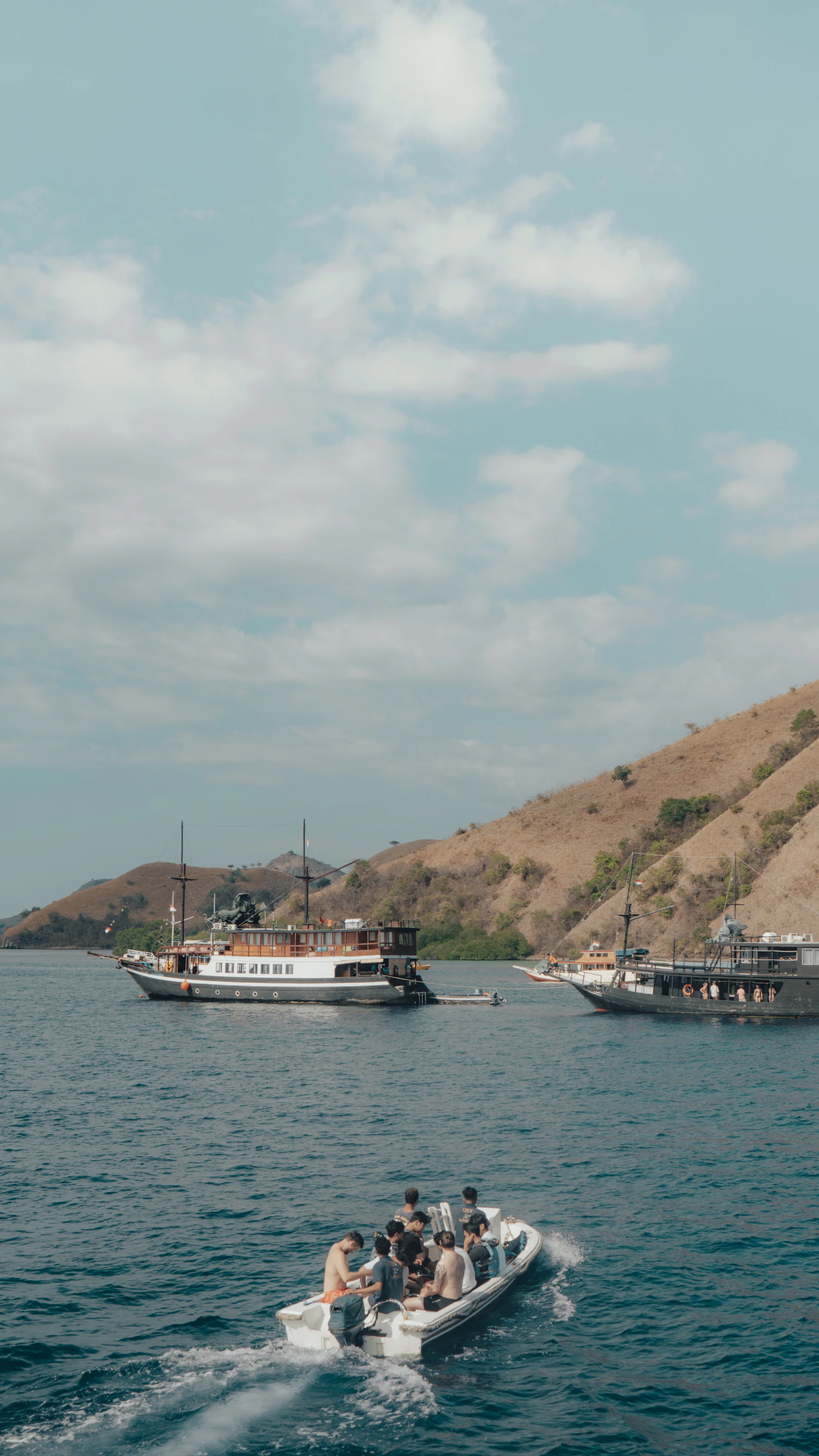 Boat travelling among islands near Labuan Bajo during a multi-day itinerary