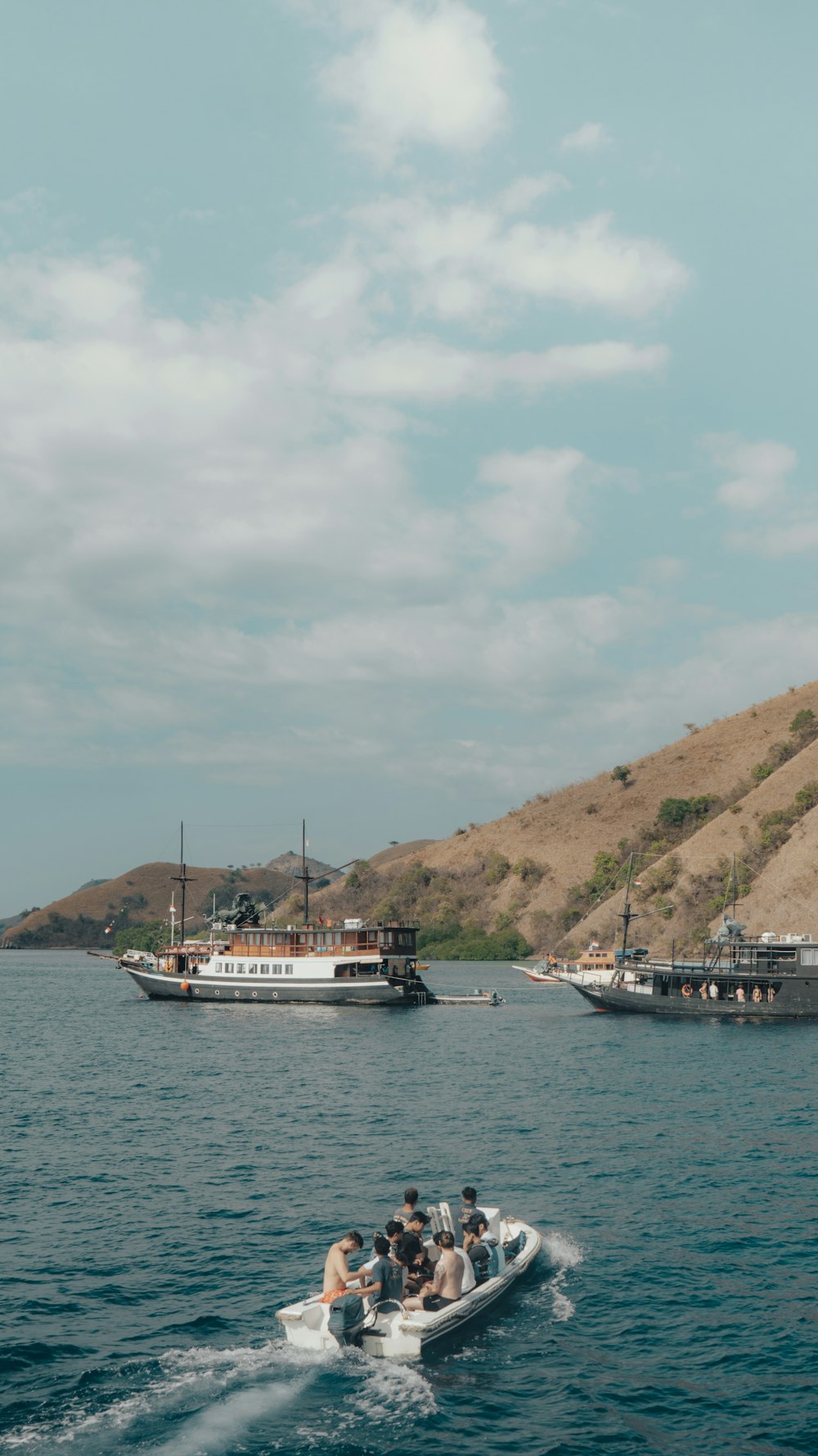 a group of people on a boat in the water