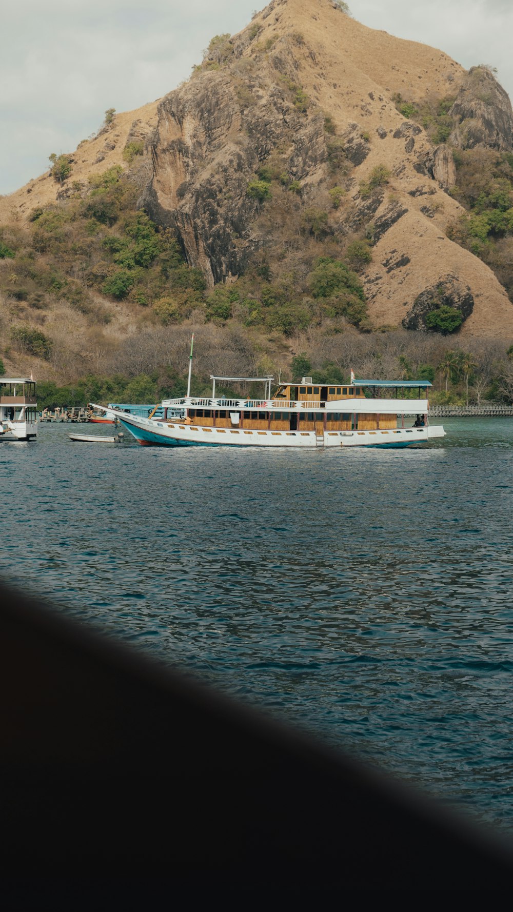 a large boat floating on top of a body of water