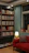 A cozy reading nook with a person enjoying a Nollywood movie blog on a laptop.