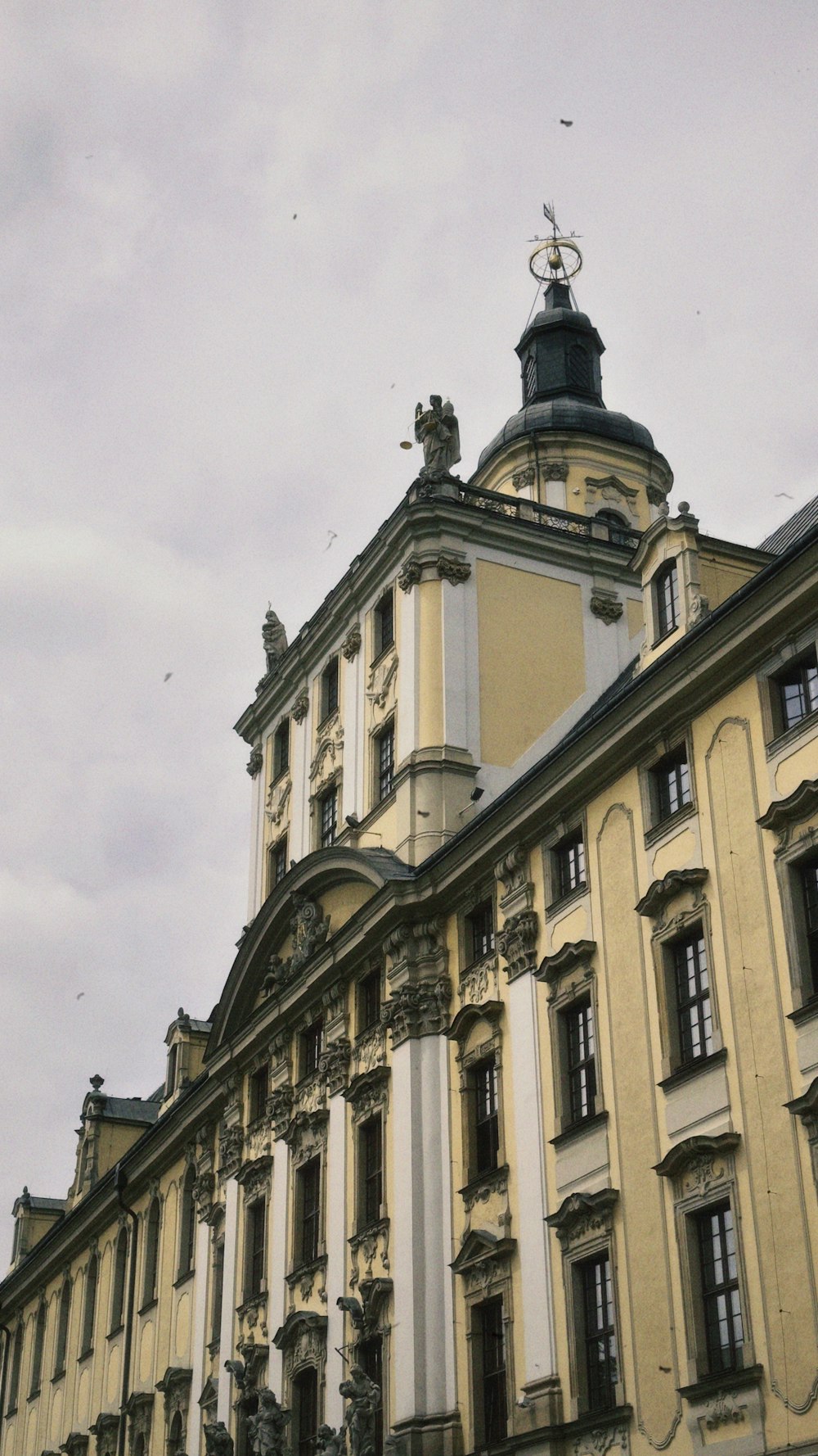 a tall building with a clock on the top of it