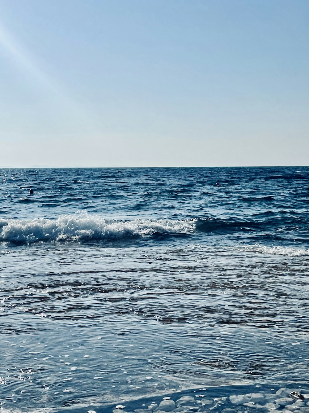 a person riding a surfboard on a wave in the ocean