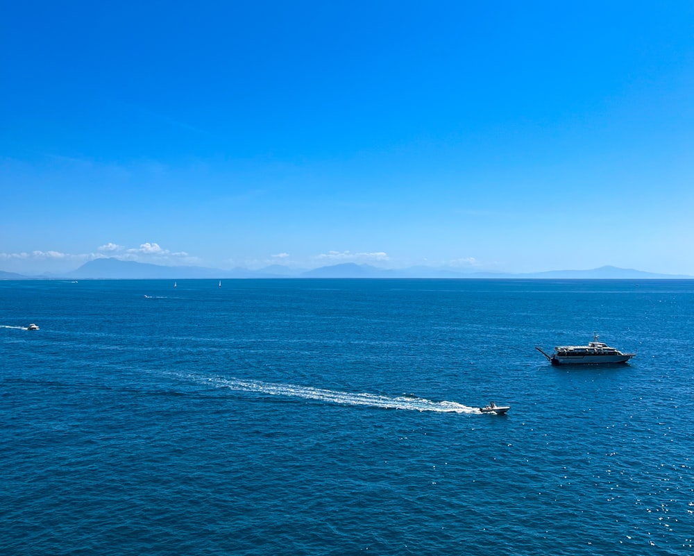 a boat traveling across a large body of water