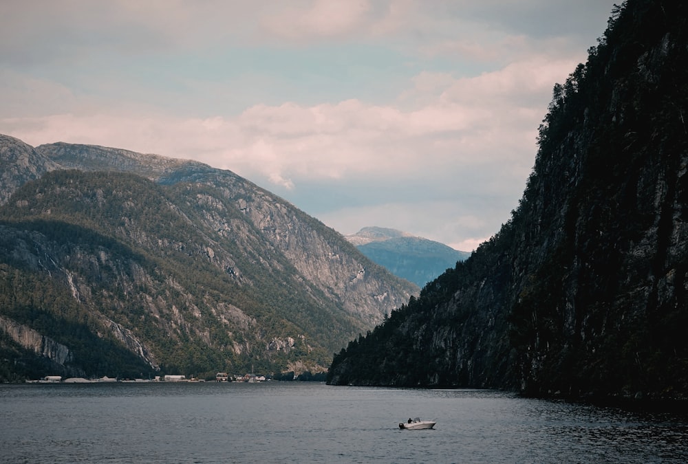 a small boat in a large body of water