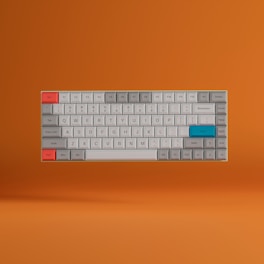 A mechanical keyboard with a compact layout is shown against a solid orange background. The keys are mostly gray, with some accents in red and blue, particularly the Esc and Enter keys. The keyboard seems to be hovering slightly above the background, giving a modern and minimalist look.