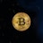 A golden coin featuring the Bitcoin symbol is centered against a black background. The coin displays intricate circuit-like patterns and inscriptions around its edge.